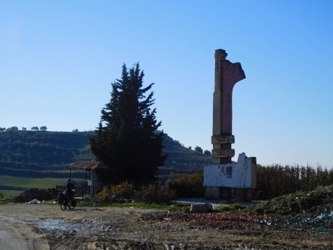 Typical roadside monument in Albania - zoom in to see the detail